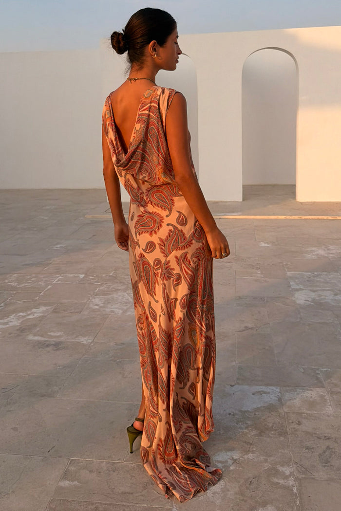 Peach Paisley Ava Dress featuring a low cowl back and bias-cut maxi silhouette in a lightweight paisley print.