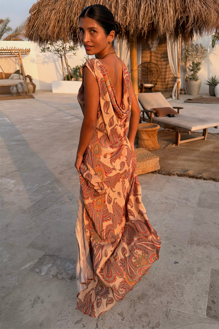 Peach Paisley Ava Dress featuring a draped cowl back and all-over paisley print, ideal for a vacation look.