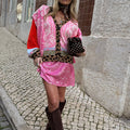 Pink Bandana Mini Dorris Skirt in a paisley print, styled with a patterned cardigan and tall brown boots.