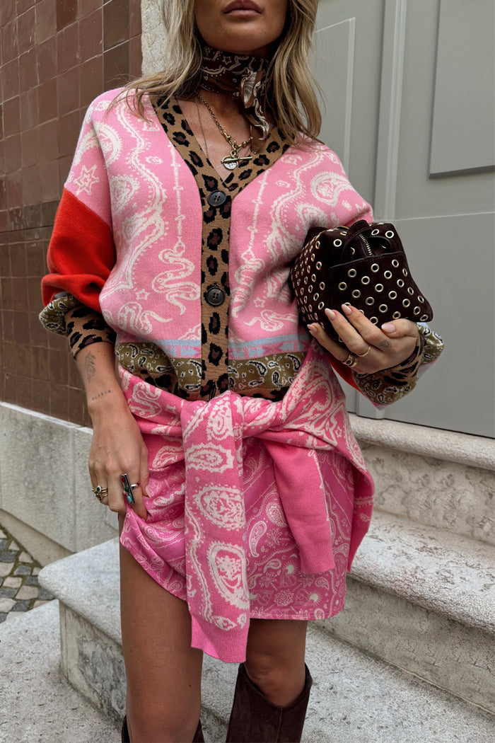 Pink Bandana Mini Dorris Skirt in a paisley print, styled with a leopard-trim cardigan for a transeasonal look.
