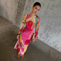 Pink Dallas Mesh Dress featuring a multi-colour cowboy print and long sleeves, styled with a beaded clutch bag.