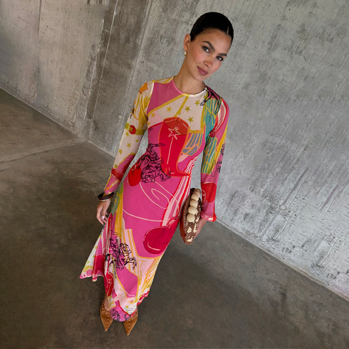 Pink Dallas Mesh Dress featuring a multi-colour cowboy print and long sleeves, styled with a beaded clutch bag.