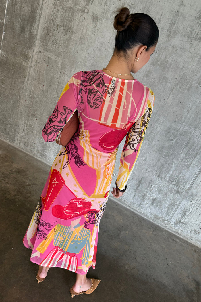 Pink Dallas Mesh Midaxi Dress with abstract cowboy motifs and long sleeves in a sheer, stretchy fabric.