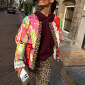 Pink Dallas Reversible Jacket with quilted cowboy motifs, leopard trim and lace cuffs in a street style setting.