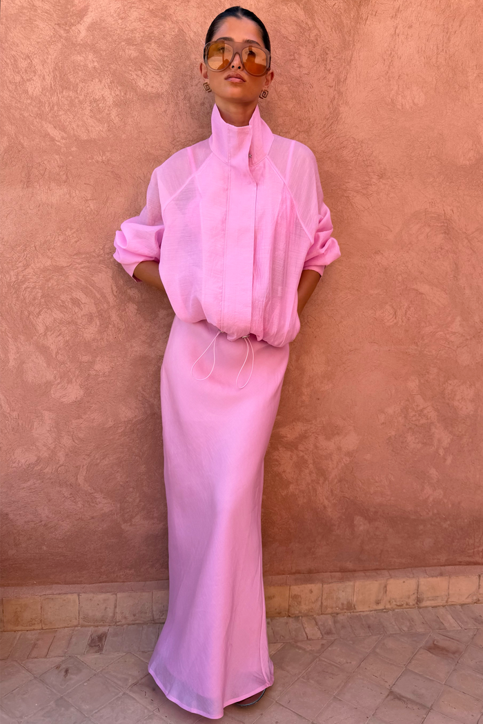 Pink Organza Funnel Jacket with a drawstring hem and semi-sheer finish, styled with a matching long skirt.