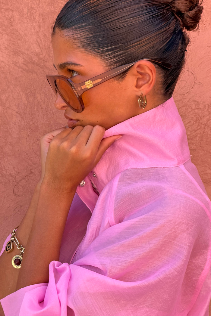 Pink Organza Funnel Jacket in semi-sheer fabric with a statement funnel collar, styled in a profile close-up.