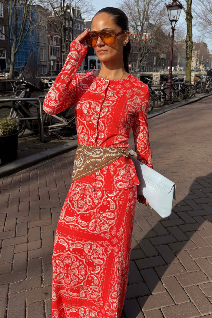 Red Bandana Alexa Cardigan in a ribbed knit with an iconic print, styled as a co-ord set with a matching skirt.