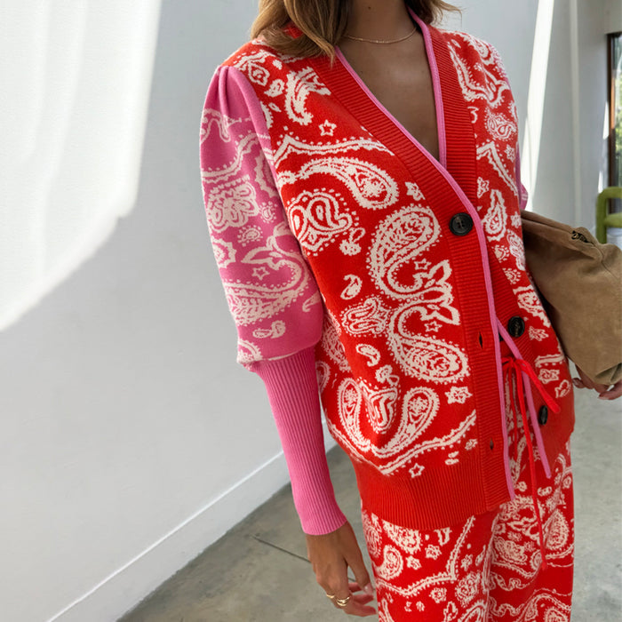 Red Bandana Martha Cardigan in a soft pink and red paisley knit with black buttons and puffed sleeves.