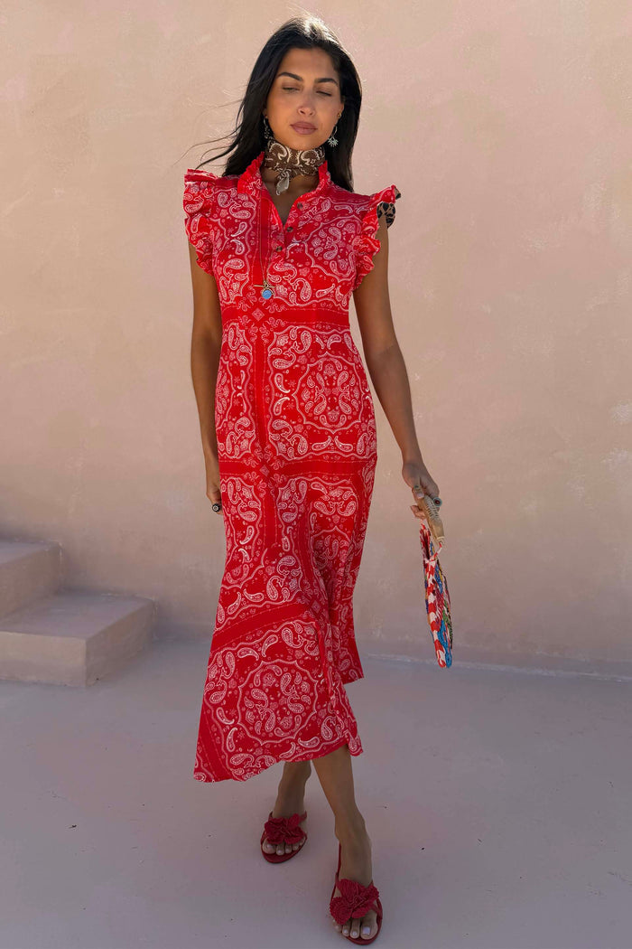 NFD Red Bandana Remi Dress with leopard sleeves and a frilled neckline, styled with a neck scarf and red floral sandals.