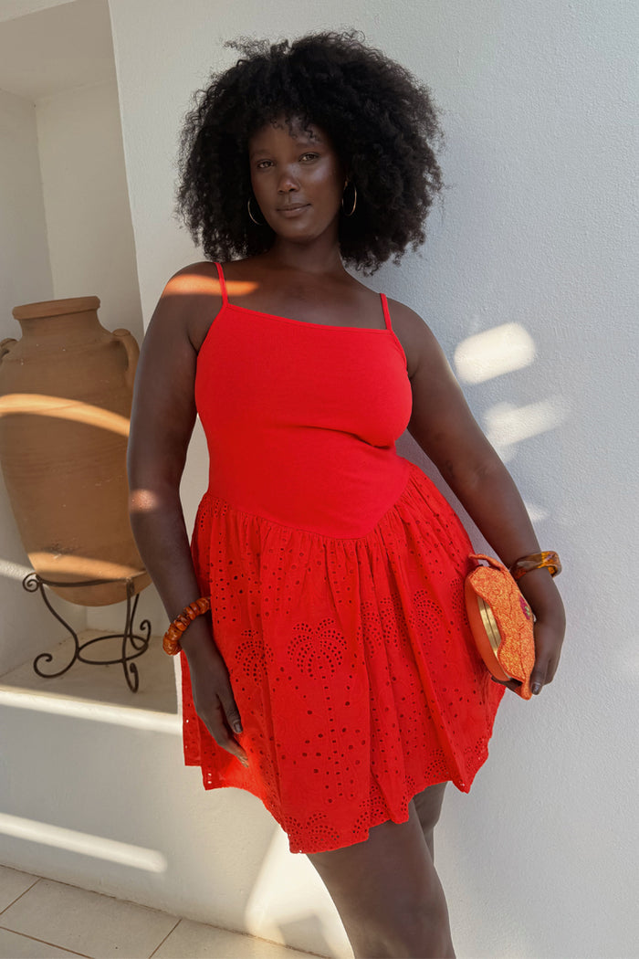 Red Broderie Mini Lola Dress in cotton with palm embroidery, highlighting inclusive sizing and summer vacation style.