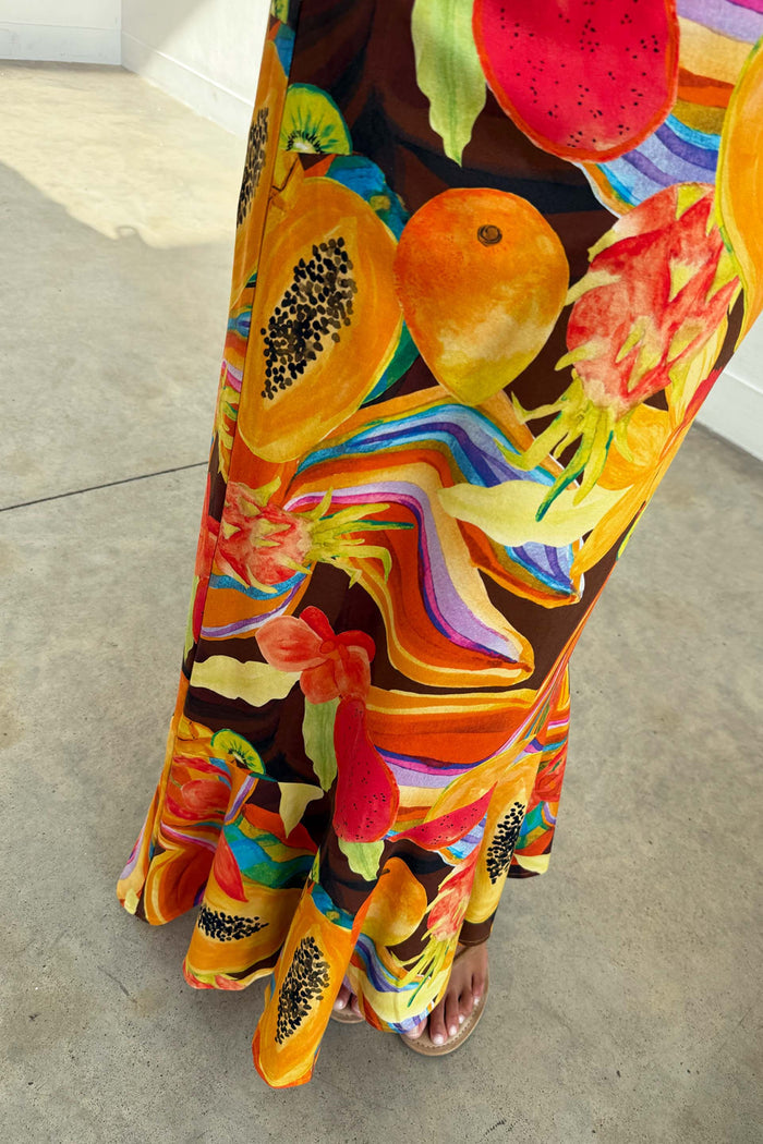 Rio A-Symmetric Skirt in a tropical fruit print jersey, featuring an asymmetric flared hem and papaya motifs.