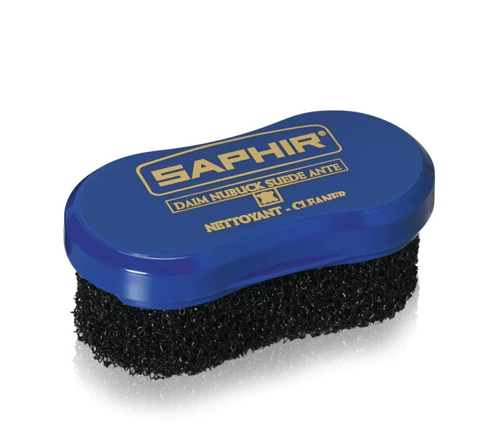 A blue sponge with a black brush designed for cleaning suede and nubuck, branded with the name 'SAPHIR'.
