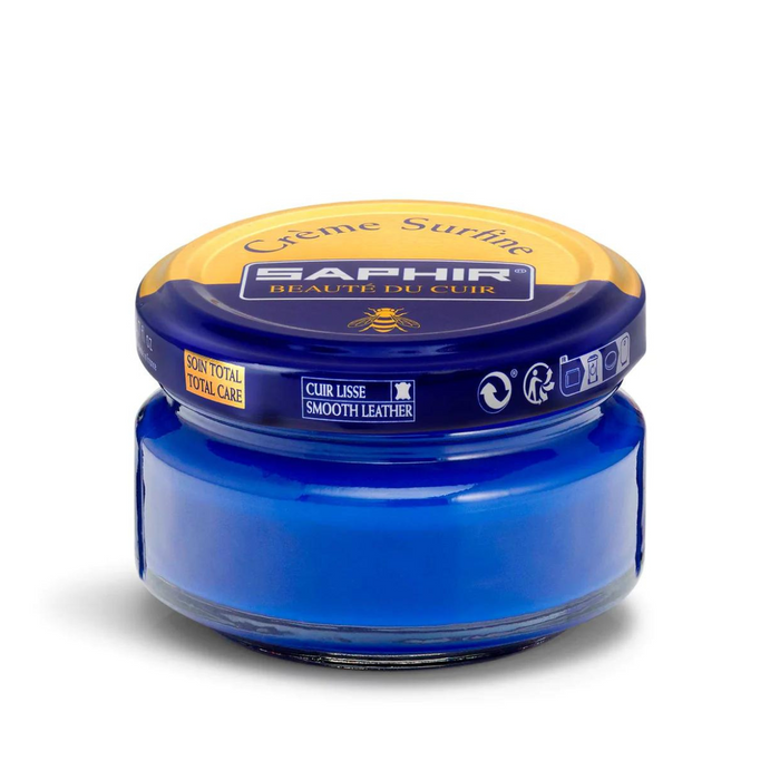 A jar of Saphir Creme Surfine shoe polish with a label on the lid.