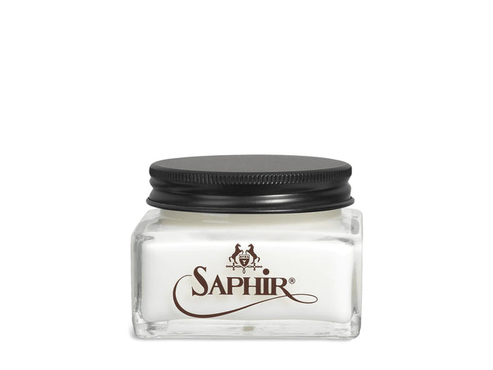 A glass jar with a black lid labeled 'SAPHIR' containing cream shoe polish.