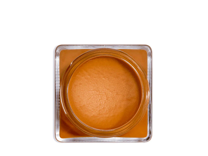 A glass jar 'SAPHIR' containing cream shoe polish.