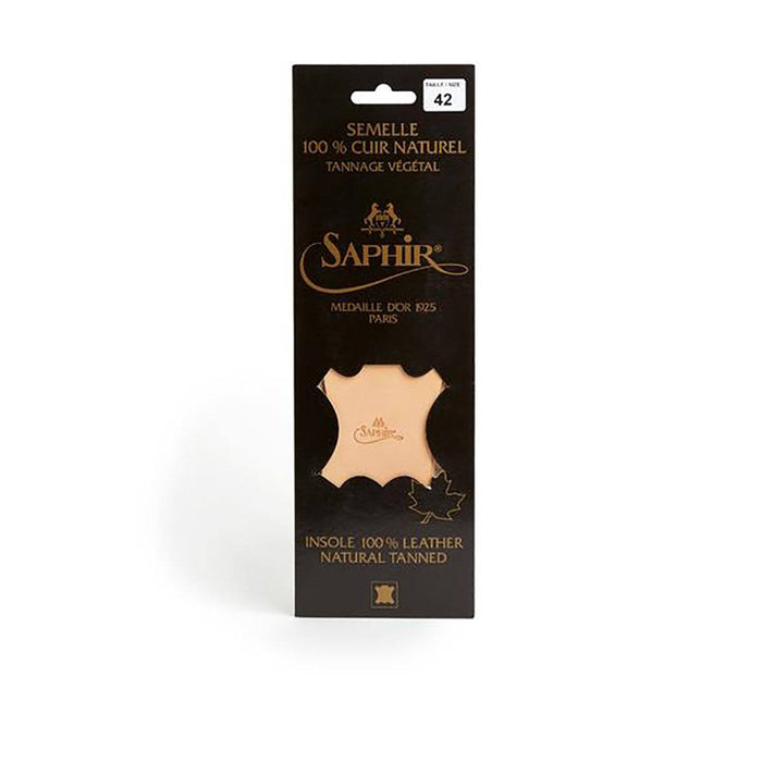 A pair of beige Saphir Medaille D'Or leather insoles with the brand's logo embossed at the heel.
