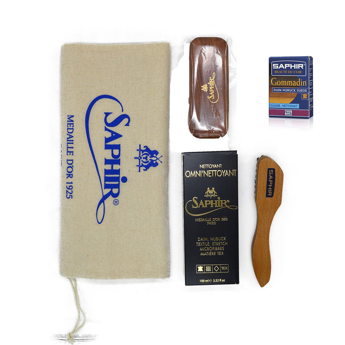 Saphir shoe care products including a pouch, brush, and boxes on a white background