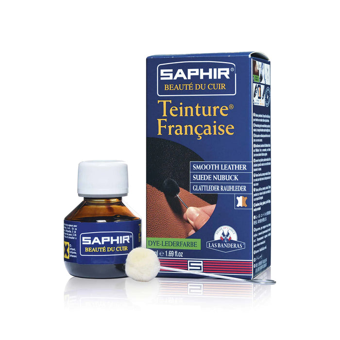 A product image featuring a box and bottle of Saphir Teinture Francaise dye for leather, with a color swatch and branding visible.