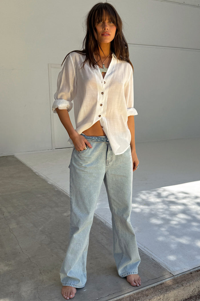 Blue Scallop Detail Straight Leg Jeans in structured denim paired with a white button-down shirt.