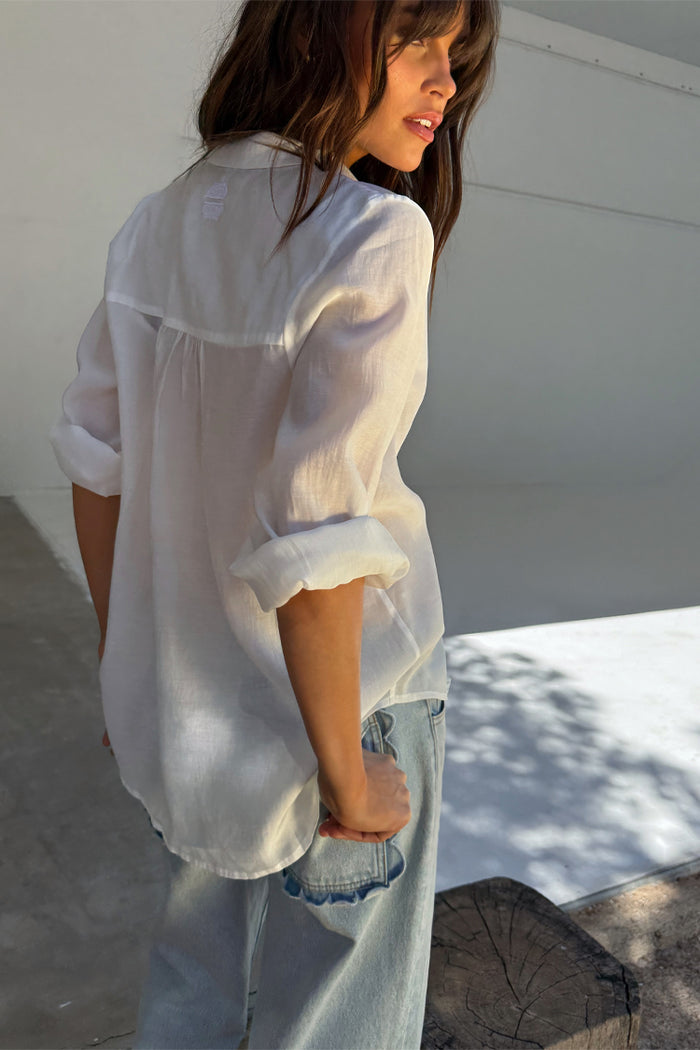 Blue Scallop Detail Straight Leg Jeans styled with a white shirt, showcasing the unique scalloped back pockets.