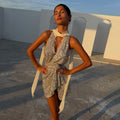 Silver Sequin Lily Top with delicate lace ties and matching Jaspre skirt, worn by a model in golden hour light.