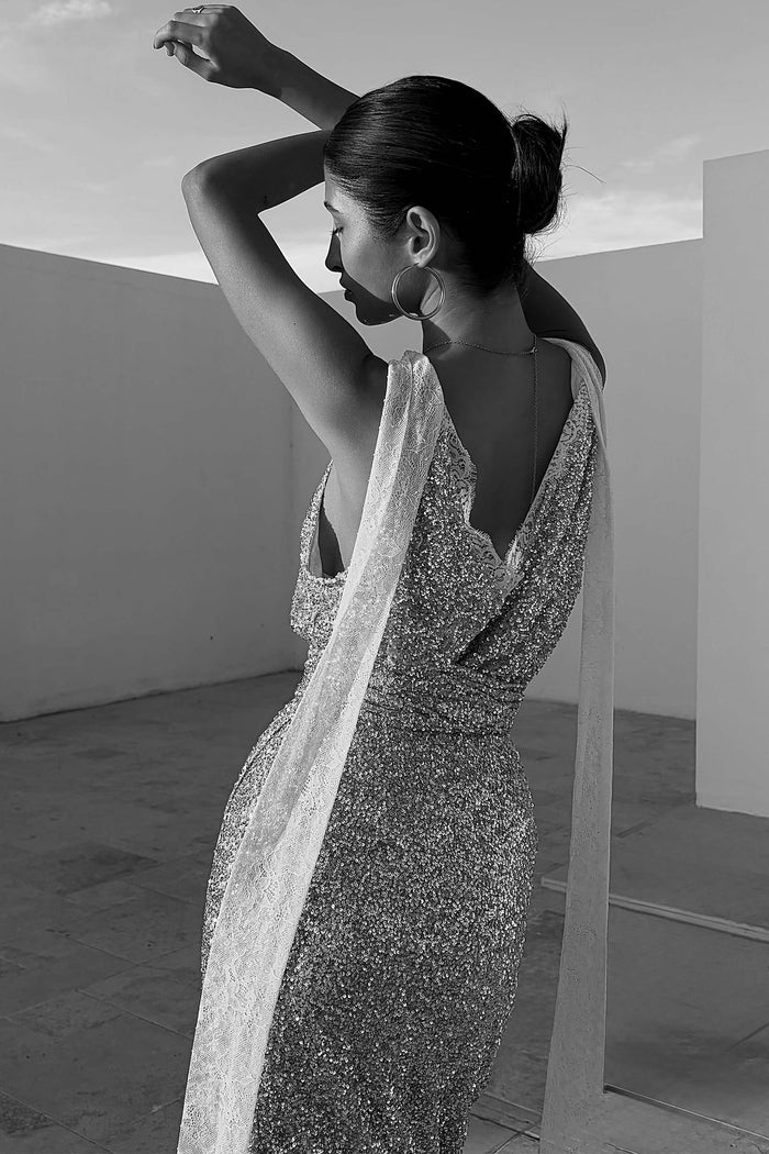 Silver Sequin Lily Top with multi-wear lace ties and a lace-trimmed V-back, shown on a model from the back.