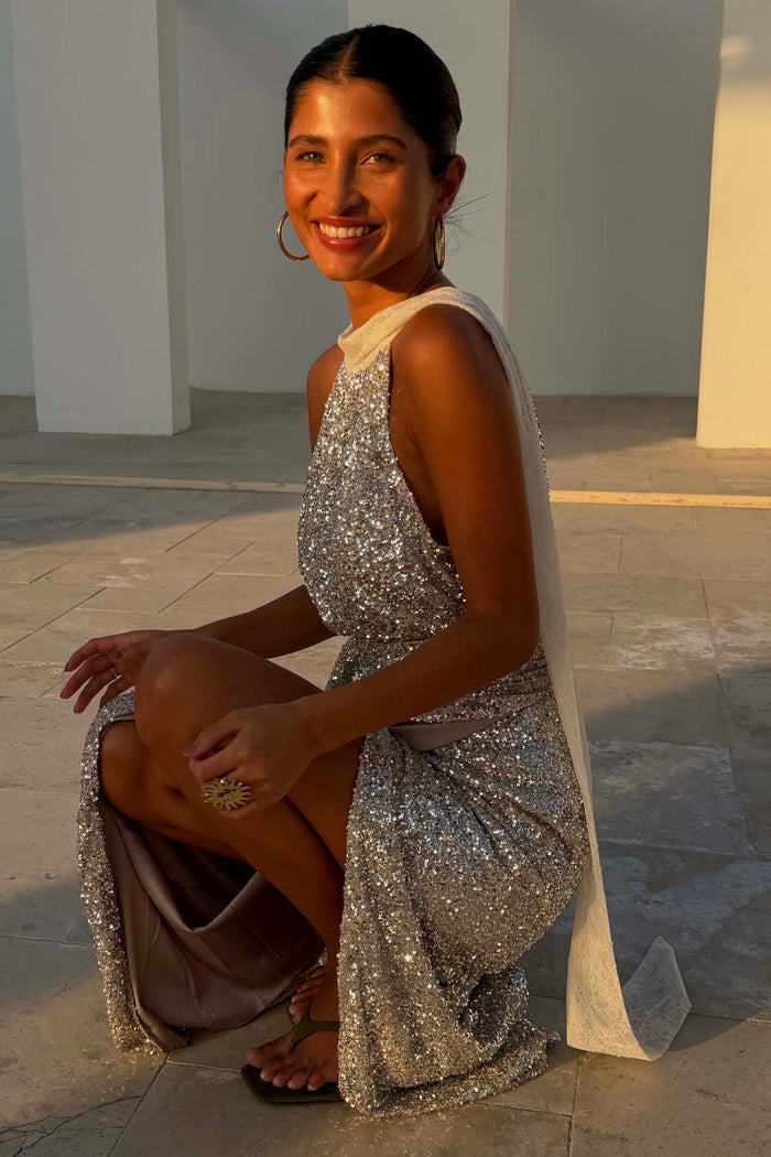 Silver Sequin Lily Top with white lace tie-neck fastenings, styled as a multi-wear piece with a matching skirt.