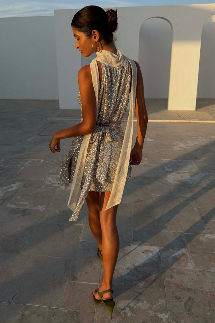 Silver Sequin Lily Top with cream lace tie fastenings and multi-wear styling, designed in London and shown from the back.