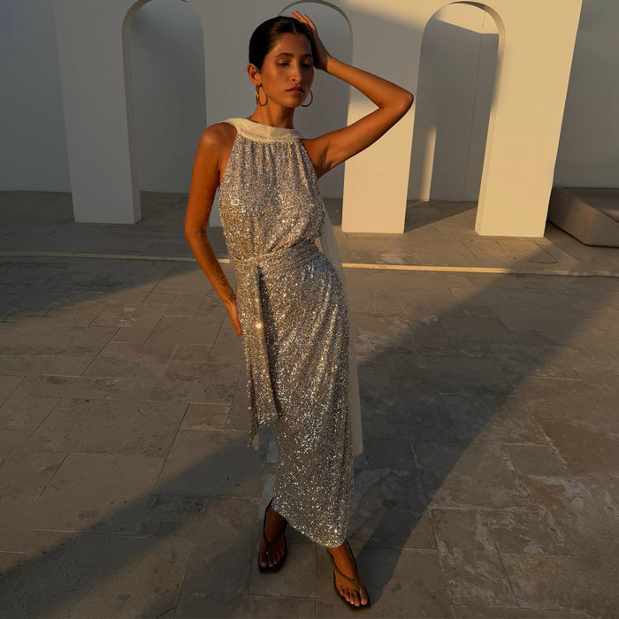 Silver Sequin Maxi Wrap Jaspre Skirt styled with a matching top outdoors at golden hour.