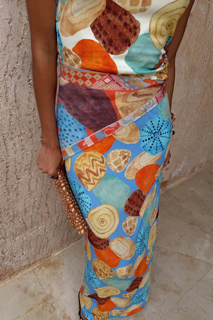 Shell Ribbed Skirt featuring a hand-painted shell print in blue, orange and sandy tones.