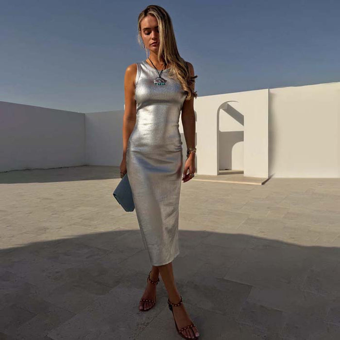 Silver Metallic Ribbed sleeveless midi dress, styled on a model against white architectural courtyard walls.