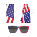 A set of American flag-themed accessories featuring patriotic red, white, and blue colors. The set includes a pair of sunglasses with one blue frame and one red frame, a rectangular cleaning cloth with a star and stripe pattern, and a matching soft drawstring pouch labeled with a "Soccer Post" tag.