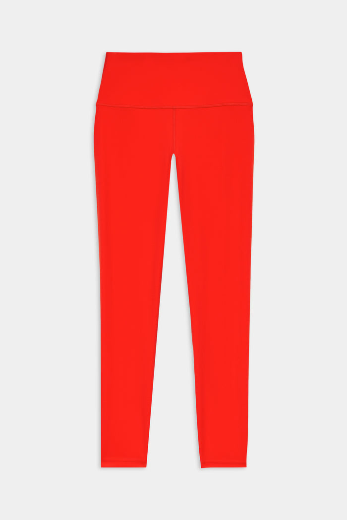 The SPLITS59 Sprint High Waist Rigor 7/8 leggings in Lotus Red feature a bright hue and high rise, crafted from Rigor fabric and shown full-length against a white background.