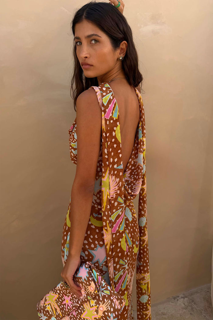 Star Fawn Sophie Dress in brown with a low back and detachable scarf detail, held with a matching clutch.