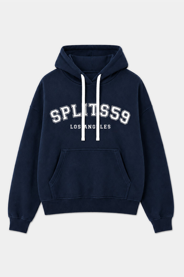 The Stella French Terry Oversized Hoodie by SPLITS59 features an indigo color, is crafted from 100% cotton, and includes white drawstrings, a kangaroo pocket, and “SPLITS59 LOS ANGELES” printed in white on the front.