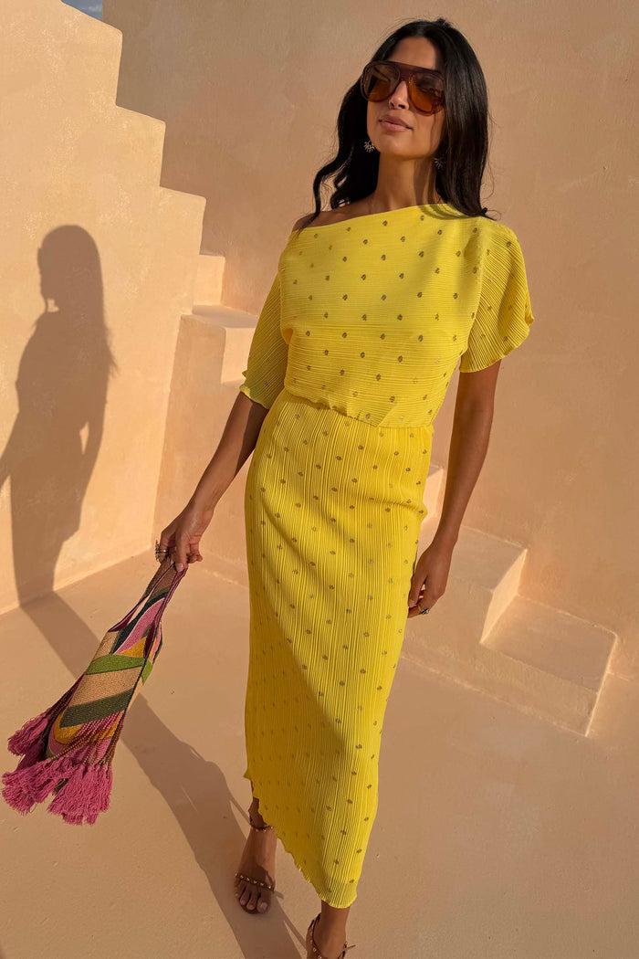 Yellow Sunshine Tilly Dress in plisse with gold flecks, worn by a 5ft7” model in size UK 10/US 6.