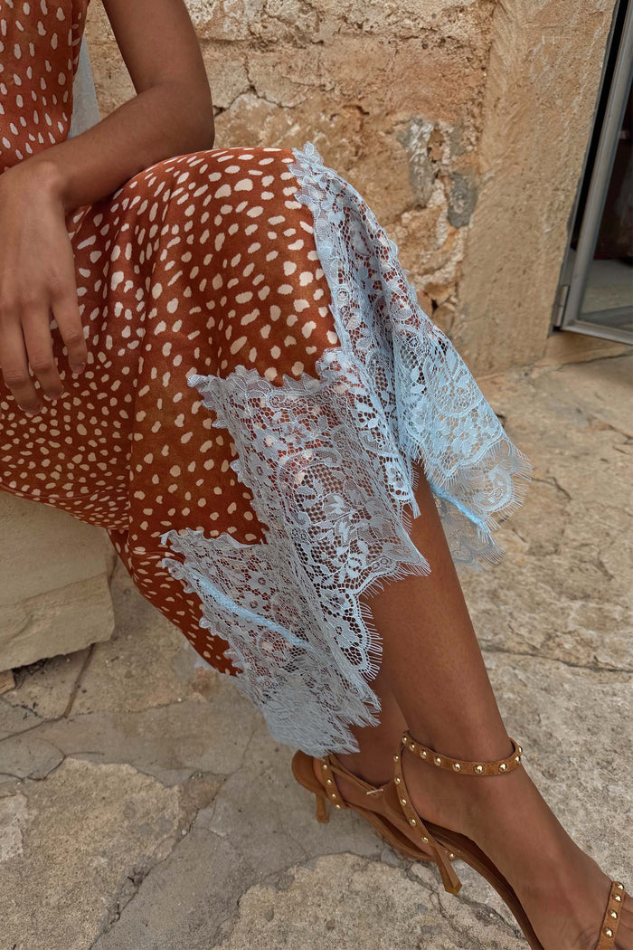 Tan Stud High Heels in suede with gold stud detailing, paired with a rust spotted dress and light blue lace.