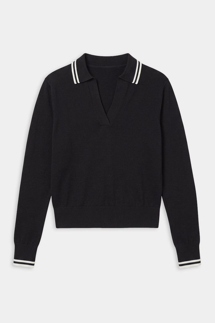 The SPLITS59 Taylor Knit Polo in Black/White is a soft rayon long-sleeve sweater with a V-neck and white double stripes on the collar and cuffs.