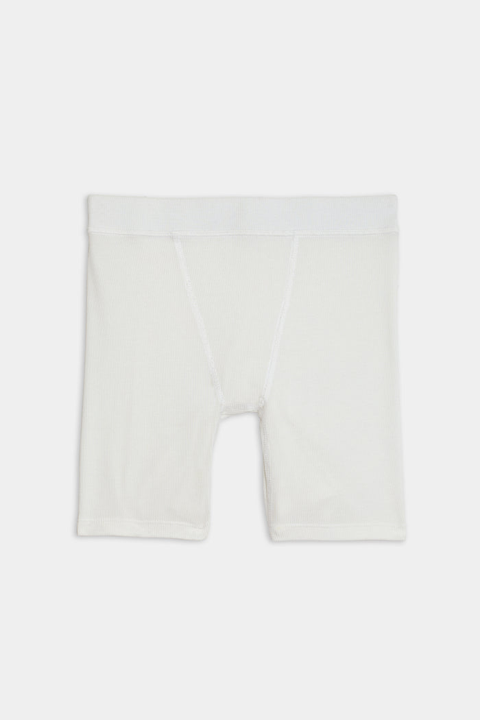 White, knee-length Theo Rib Short - White with a fitted design crafted from a blend of MODAL and SPANDEX fabric, featuring an elastic waistband, displayed against a plain background by SPLITS59.