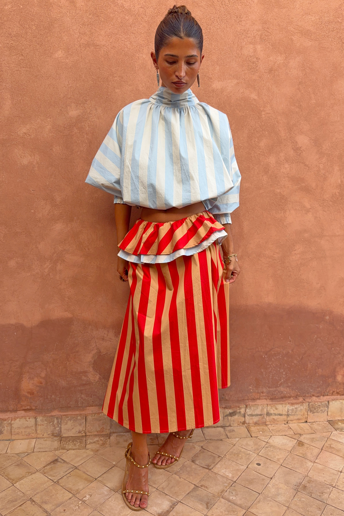Tomato Stripe multi-wear dress styled as a red and camel maxi skirt with a blue striped high-neck scarf top.