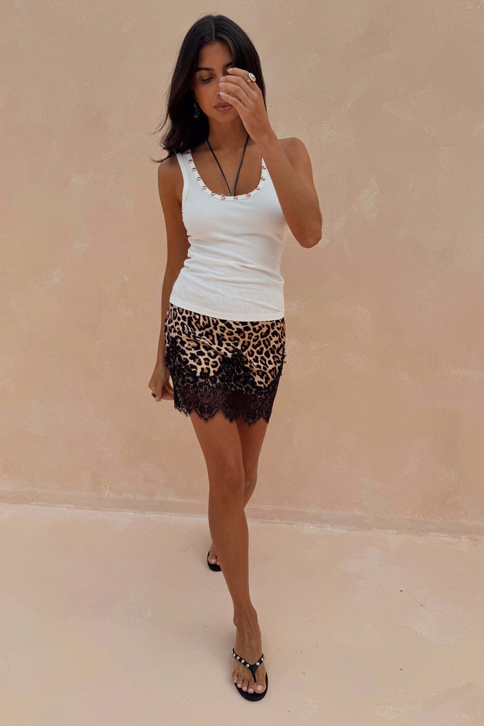 White Studded Rib Vest with gold neckline detail, paired with a leopard print and black lace mini skirt.