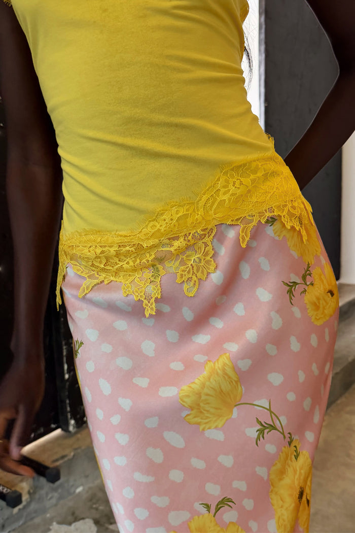 Yellow Lace Insert Top featuring an asymmetric lace hem and intricate floral lace, designed in London.